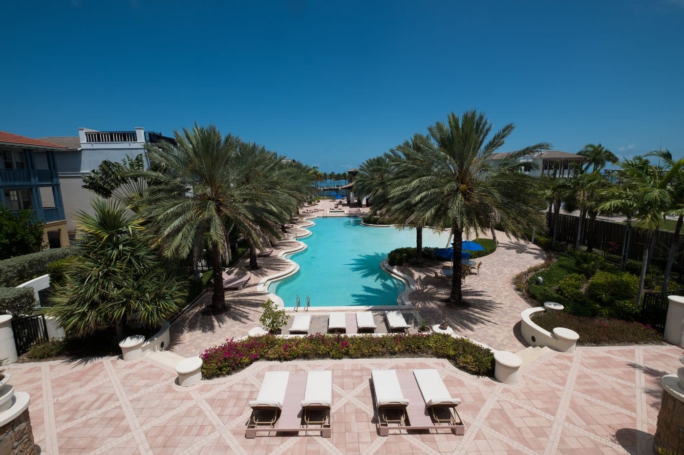 Beach-entry pool at Marlin Bay Yacht Club seen from a residence balcony